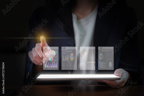 Fototapeta Close-Up Image of a Businesswoman's Hand Using a Digital Tablet.