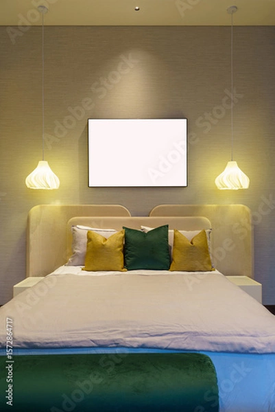 Fototapeta Generated Symmetrical view of a modern bedroom with a large blank frame for mockup. Twin pendant lights hang over a neatly made bed with green and yellow pillows.
