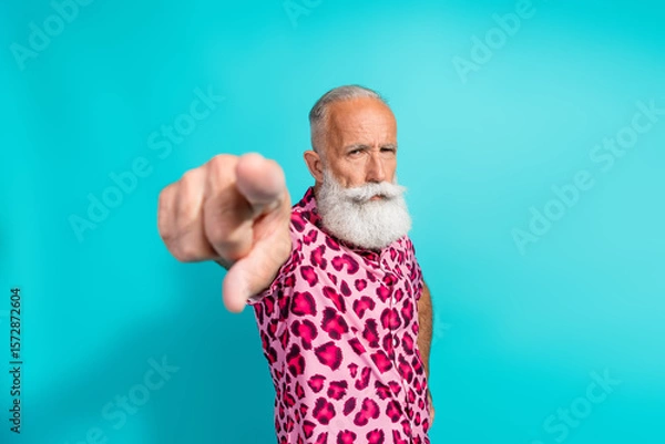 Fototapeta Photo of funny aged man point finger you wear leopard print outfit isolated on teal color background