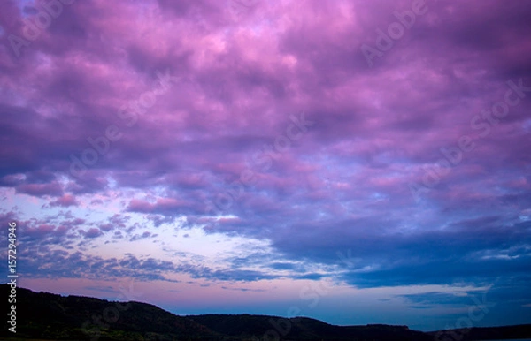 Obraz Photo of a violet sunset with clouds