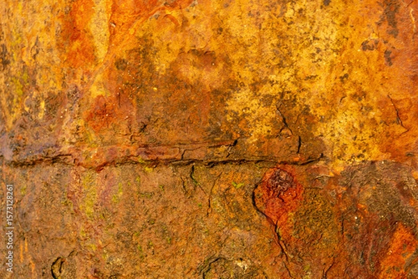 Obraz Detailed close-up of rusty steel surface showcasing corrosion marks, orange patina and aged metal texture ideal for backdrops, posters and digital art compositions.