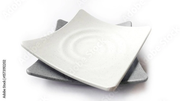 Fototapeta Stack of empty square white and grey plates with ceramic melamin material isolated on white background