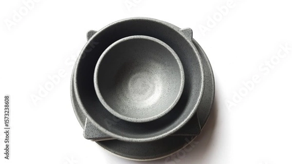 Fototapeta Stack of empty circle grey bowls and empty white grey  square plates with ceramic melamin material isolated on white background. Utensils kitchen concept