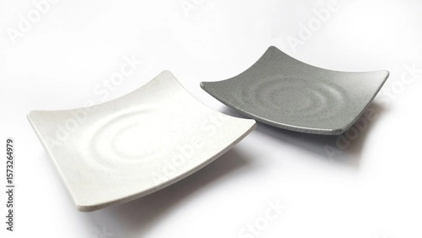 Fototapeta Empty square white and grey plates with ceramic melamin material isolated on white background
