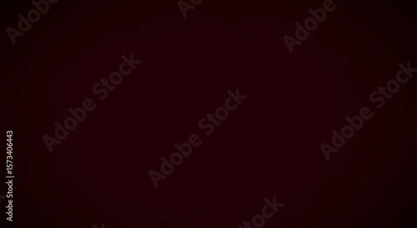 Fototapeta Solid dark maroon background with very slight noise texture, cinematic feel