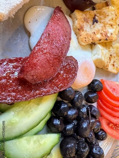 Fototapeta Turkish breakfast with spicy sausage and assorted salad elements