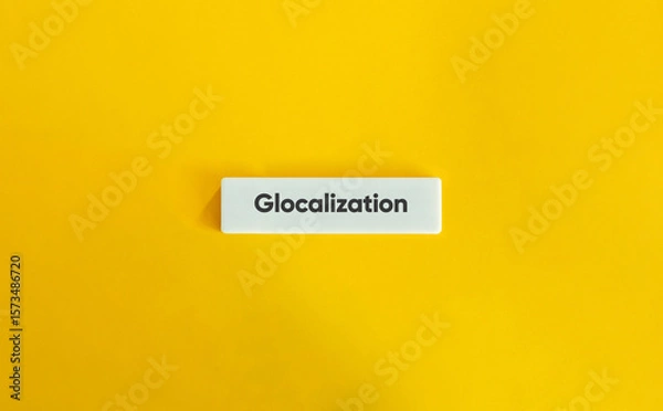 Fototapeta Glocalization Concept on Wide Letter Tile with Minimal Yellow Background