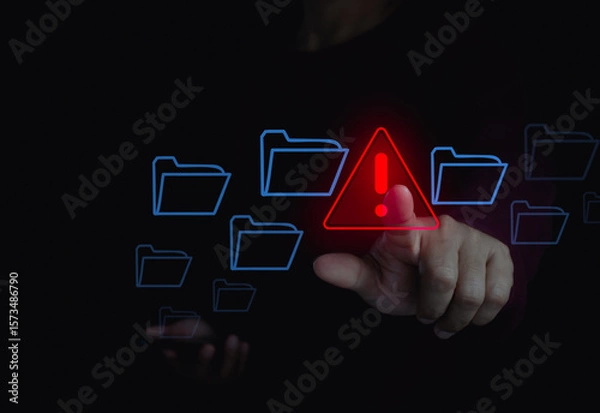 Fototapeta Cybersecurity technology warning alert with hand touching digital folder on laptop computer in cyberspace for cyber threat prevention and sensitive data security. Secure file management safety system.