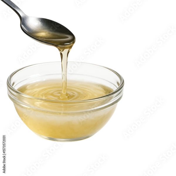 Obraz Liquid Coconut Oil Pouring from a Spoon into a Bowl, Isolated on Transparent and White Background