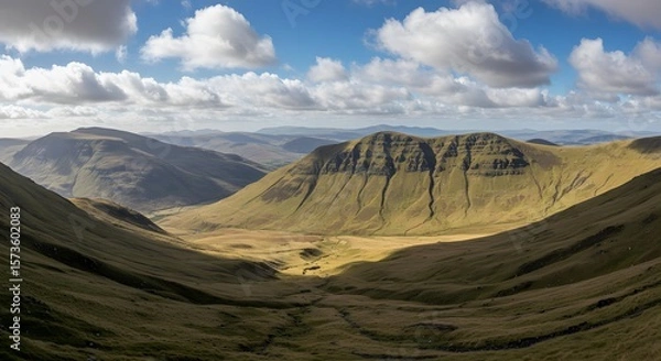 Fototapeta Expansive Highland Landscape Under a Dramatic Cloudy Sky in a Vast Open Wilderness