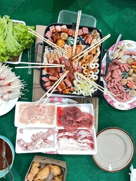 Obraz Culinary Feast: An overhead view of a vibrant and diverse array of fresh ingredients prepared for an enticing culinary experience. a symphony of tastes and textures is artfully arranged.