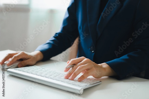 Fototapeta Woman's hands are using a computer keyboard and mouse to Searching for information. business working woman data search technology	