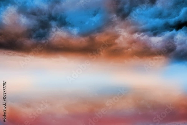 Obraz Blue orange cloudy sky background