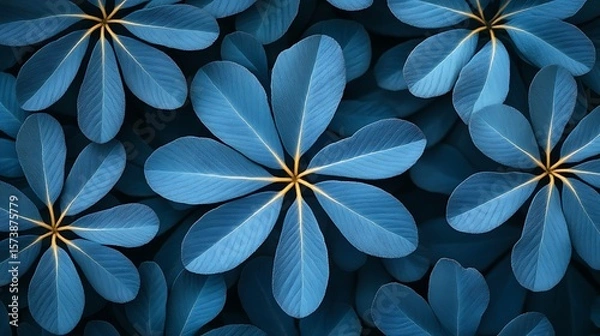 Fototapeta A vibrant pattern of deep blue leaves.