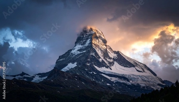 Obraz Dramatic mountain peak shrouded by stormy clouds