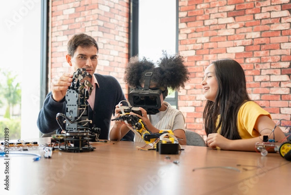Fototapeta Diverse Kids and Teacher Exploring Robotics and VR Technology, Children Learning STEM with Virtual Reality and Robot Kits, Teacher Guiding Students in Modern Tech and Engineering Class
