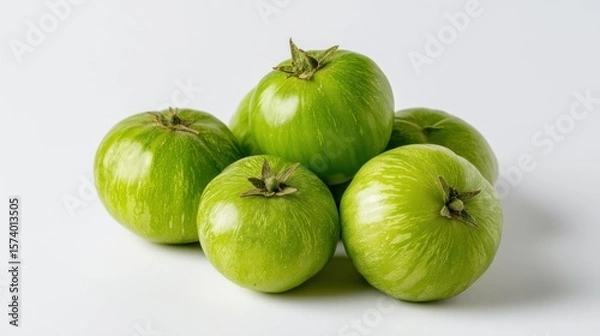 Obraz Pile of Fresh Green Zebra Heirloom Tomatoes on White Surface Close Up