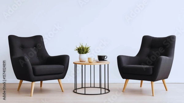 Obraz Modern black armchair paired with a light wood side table and coffee cups, isolated on white background. Minimalist and stylish interior furniture setup perfect for cozy living spaces