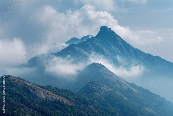 Fototapeta Hilly landscape view shrouded in mist, sky background for travel and adventures
