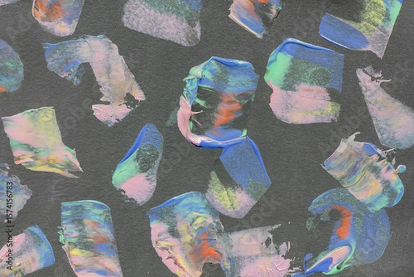 Fototapeta Colorful abstract brushstrokes on dark paper background. Vibrant acrylic or oil paint texture for modern design and creative projects.
