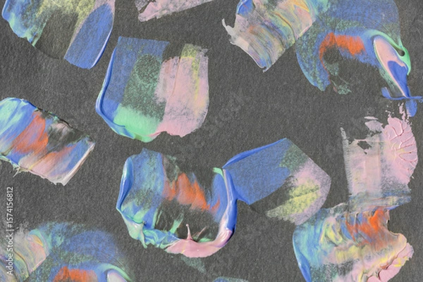 Fototapeta Colorful abstract brushstrokes on dark paper background. Vibrant acrylic or oil paint texture for modern design and creative projects.
