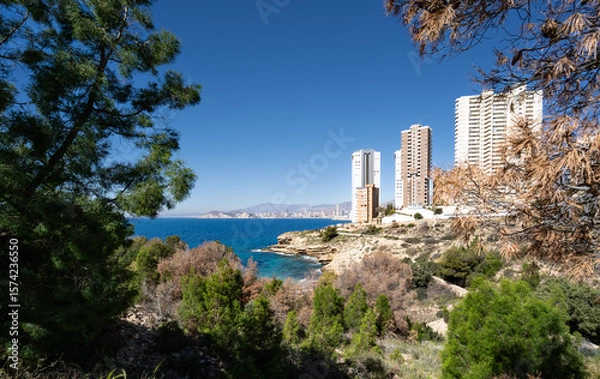 Fototapeta View of Benidorm in Spain from the coastline just to the North of the town