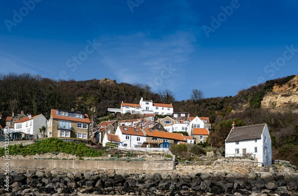 Fototapeta Beach View of the jumble of the whitewashed houses in Runswick Bay Village on the Yorkshire Coast