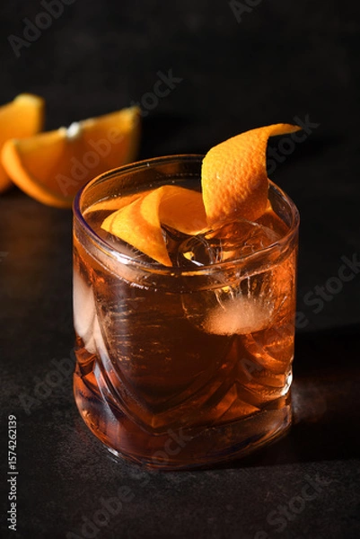 Fototapeta Classic Negroni Cocktail. Served with ice and orange zest