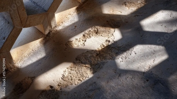 Obraz Abstract Hexagonal Shadow Patterns on a Textured Concrete Surface