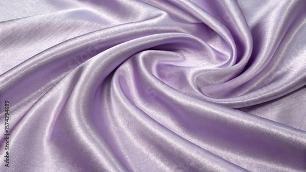 Fototapeta The soft lavender silk fabric is draped in elegant folds, creating a luxurious texture