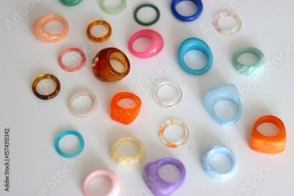 Obraz Collection of colorful plastic rings on white background. Selective focus.