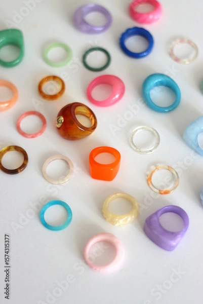 Obraz Collection of colorful plastic rings on white background. Selective focus.
