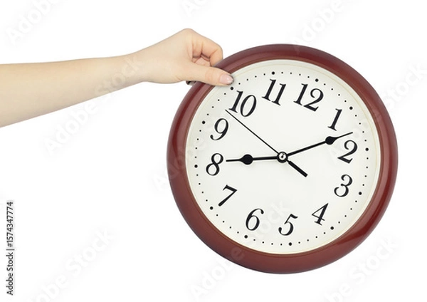 Fototapeta round wall clock in hand, outstretched hand with round wall clock isolated from background, time concept