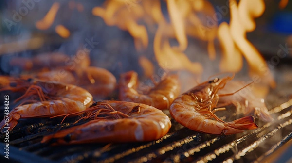 Fototapeta Grilled shrimp sizzling on barbecue, surrounded by flames and smoke, creating delicious and appetizing scene