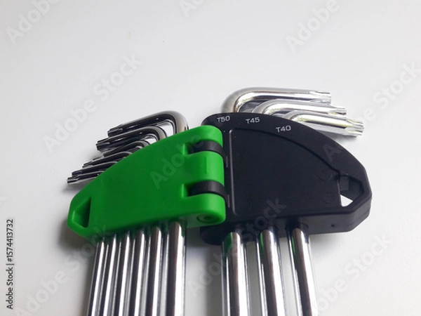 Fototapeta A set of torx keys or star L keys isolated on a white background, used to tighten or loosen shaped bolts.