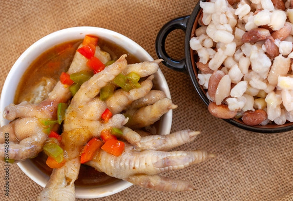 Obraz South African chicken feet stew and samp with beans