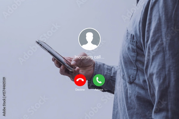 Obraz Notification of an incoming call on a smartphone held by a man wearing a shirt. Concept of mobile communication, telecommunication and incoming call notification.