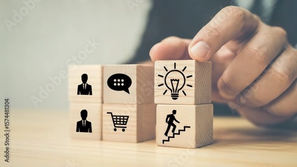 Fototapeta Business development and idea generation with wooden blocks stacked by hand