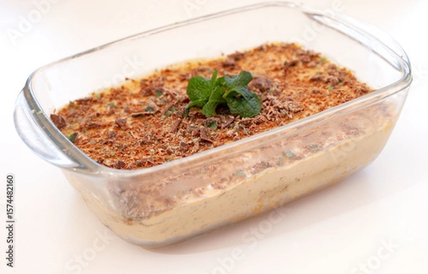 Obraz Traditional South African fridge tart in a glass dish with mint leaves and isolated on white