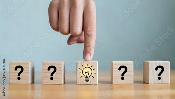 Obraz Concept of idea generation, hand pointing to lightbulb among question marks
