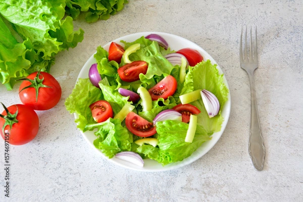 Obraz Fresh Salad on White Plate with Tomatoes and Onions