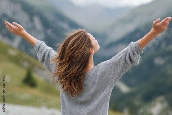 Obraz Woman breathing fresh air and enjoying freedom in the mountains