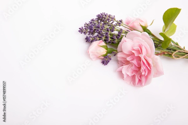 Fototapeta Pink rose and lavender bouquet with craft tag on white background, floral composition with copy space, elegant botanical layout for wedding invitation, birthday greeting, packaging, spa concept