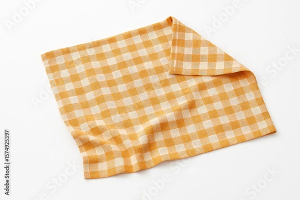 Fototapeta A checkered orange and white napkin isolated on white background