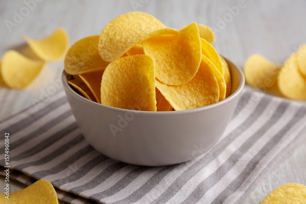 Fototapeta Potato Chips in a Bowl, side view. Close-up.