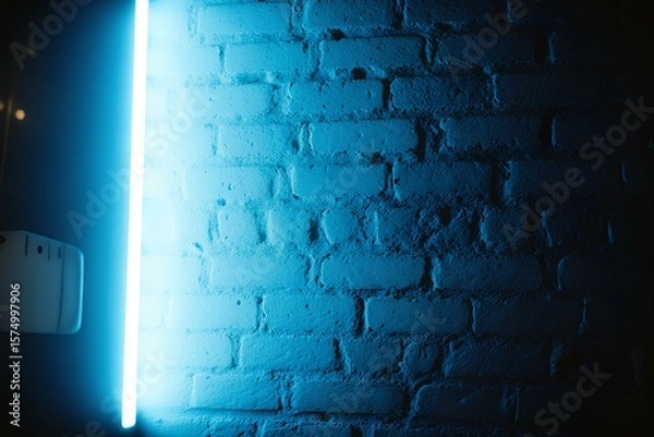 Fototapeta Blue Neon Light on a Brick Wall at Night, Urban Futuristic LED Glow with Concrete Texture, Nightclub Atmosphere, Vibrant Cyberpunk Backdrop, Illuminated City Street Vibes