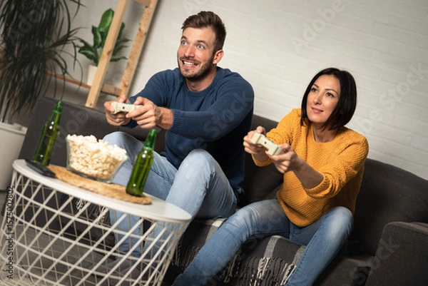 Obraz Young couple playing video games