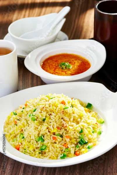 Fototapeta Crab Fried Rice Set including with fresh vegetables like carrots and green bell peppers with Savory Soup and hot Tea served side view of asian cousin