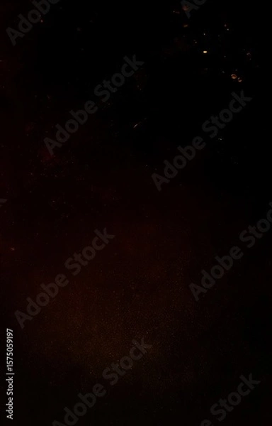 Fototapeta Ember particles floating within the darkness
