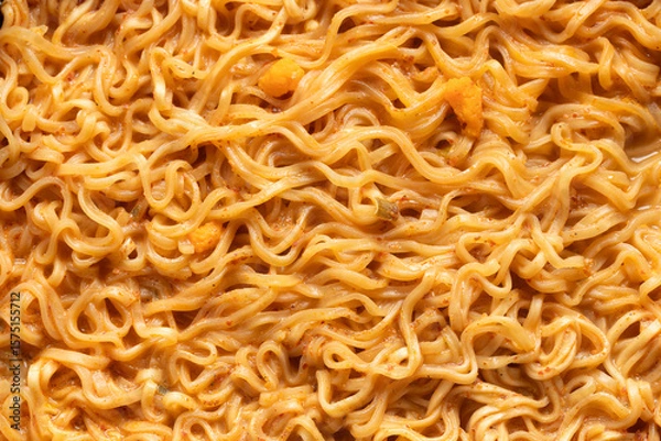 Fototapeta Top view of instant noodles in spicy soup for background